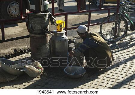 Man Washing Dishes In Charikar, Parwan Province, Afghanistan View Large Photo Image Stock Image - Man Washing Dishes In Charikar, Parwan Province, Afghanistan. Fotosearch