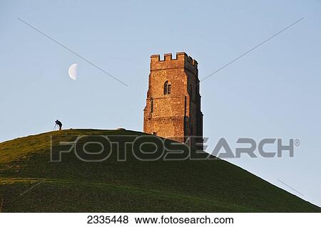 Man Watching Moon With A Telescope Near Tower; Glastonbury, Somerset, England View Large Photo Image Stock Photo - Man Watching Moon With A Telescope Near Tower; Glastonbury, Somerset, England. Fotosearch