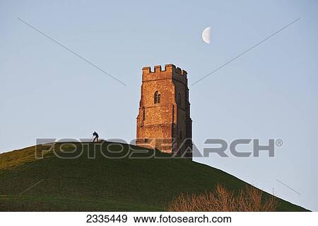 Man Watching Moon With A Telescope Near Tower; Glastonbury, Somerset, England View Large Photo Image Stock Photo - Man Watching Moon With A Telescope Near Tower; Glastonbury, Somerset, England. Fotosearch