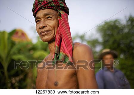Stock Photo - Man wearing a krama; Battambang, Cambodia. Fotosearch
