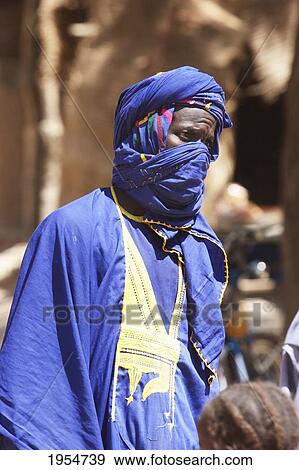 Man wearing a turban at the Monday Market in Djenne, Mali View Large Photo Image Stock Photo - Man wearing a turban at the Monday Market in Djenne, Mali. Fotosearch