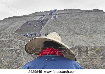 Man wearing sombrero in front of the Pyramid of the Sun at Teotihuacan; San Juan Teotihuacan, State of Mexico, Mexico View Large Photo Image Stock Photo - Man wearing sombrero in front of the Pyramid of the Sun at Teotihuacan; San Juan Teotihuacan, State of Mexico, Mexico. Fotosearch