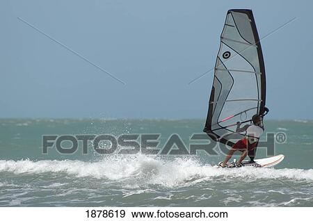 Stock Photo - Man Windsurfing On Sea. Fotosearch