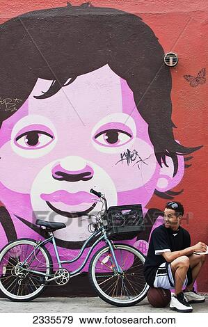 Man With Bike With Graffiti In Background; California, Usa View Large Photo Image Stock Photo - Man With Bike With Graffiti In Background; California, Usa. Fotosearch