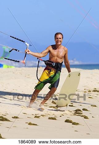 Man With Kite Surfing Equipment View Large Photo Image Stock Photo - Man With Kite Surfing Equipment. Fotosearch