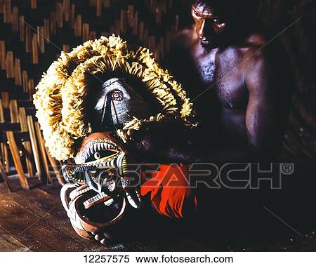 Man with Malangan mask; Kaviang, New Ireland, Papua New Guinea View Large Photo Image Stock Photography - Man with Malangan mask; Kaviang, New Ireland, Papua New Guinea. Fotosearch