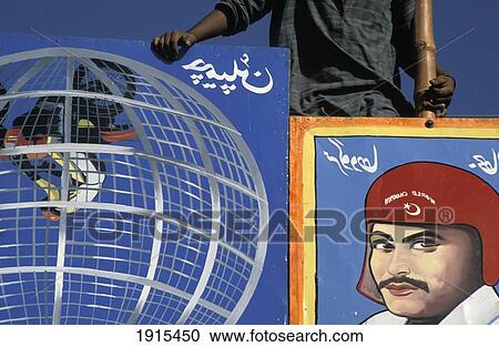 Stock Image - Man With Poster Of Stunt Motorcylist At A Circus. Fotosearch