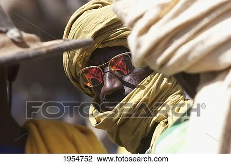 Man with turban at the Monday Market in Djenne, Mali View Large Photo Image Stock Image - Man with turban at the Monday Market in Djenne, Mali. Fotosearch