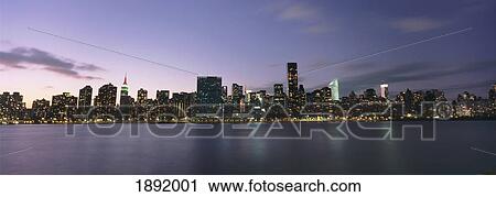 Stock Image - Manhattan Island Viewed From Long Island City At Dusk. Fotosearch