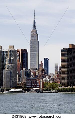 Stock Photo - Manhattan skyline, as seen from the East River, New York City, New York, United States. Fotosearch