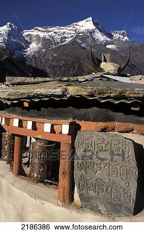 Mani Stones, Prayer Wheels And Kwande Ri, Namche Bazaar, Nepal View Large Photo Image Stock Photograph - Mani Stones, Prayer Wheels And Kwande Ri, Namche Bazaar, Nepal. Fotosearch