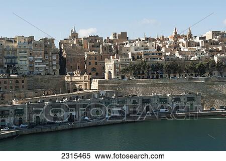 Many levels and sizes of buildings on hillside of Grand Harbor; Valetta, Malta View Large Photo Image Stock Photography - Many levels and sizes of buildings on hillside of Grand Harbor; Valetta, Malta. Fotosearch