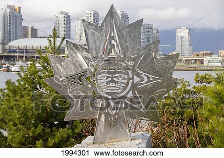 Maple Leaf Sculpture With A Haida Design In The Olympic Village, Vancouver, British Columbia, Canada View Large Photo Image Stock Image - Maple Leaf Sculpture With A Haida Design In The Olympic Village, Vancouver, British Columbia, Canada. Fotosearch