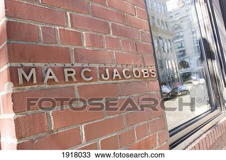 Stock Image - Marc Jacobs Store Sign On Wall. Fotosearch