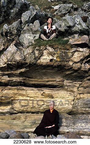 Marie Helvin & Nun Meditate Amongst The Rocks, Buddhist Retreat / Monastery, Holy Island, The Hebrides, Scotland, UK View Large Photo Image Stock Photo - Marie Helvin & Nun Meditate Amongst The Rocks, Buddhist Retreat / Monastery, Holy Island, The Hebrides, Scotland, UK. Fotosearch