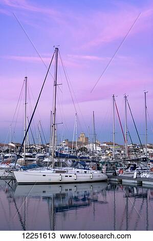 Stock Image - Marina at dusk; Saintes-Maries-de-la-Mer, Provence-Alpes-Cote D'Azur, Bouches-Du-Rhone, France. Fotosearch