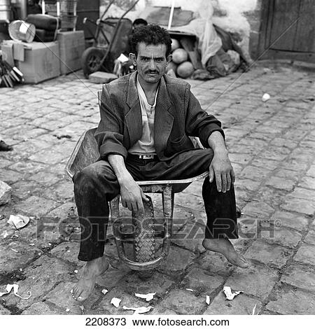 Market Porter Sitting In His Barrow In Sanaa, Yemen View Large Photo Image Stock Image - Market Porter Sitting In His Barrow In Sanaa, Yemen. Fotosearch