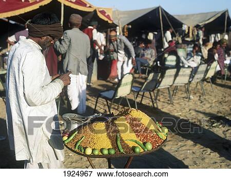 Market Vendor Selling Snacks View Large Photo Image Stock Photo - Market Vendor Selling Snacks. Fotosearch