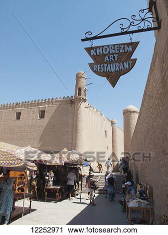 Stock Image - Markets stalls in front of Tosh Hauli Palace, Ichan Kala Old City; Khiva, Uzbekistan. Fotosearch
