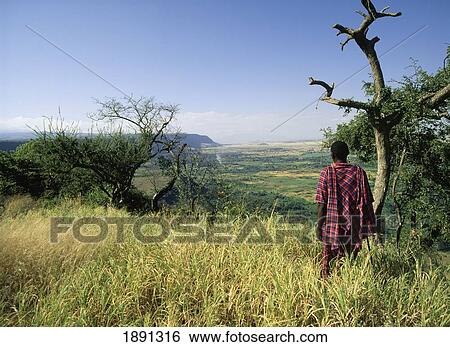 Stock Photograph - Masai Tribesman On Edge Of Rift Valley. Fotosearch