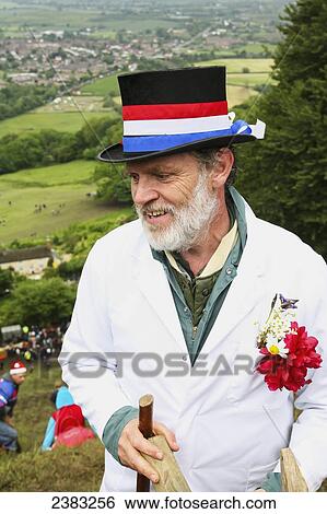 Stock Photograph - Master of ceremonies at the Cheese Rolling at Coopers Hill; Brockworth, Gloucestershire, England. Fotosearch