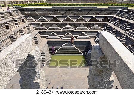 Matanga Tank, An Impressive, Large Symmetrical Stone-Stepped Tank At Hampi, Karnataka, India View Large Photo Image Stock Photo - Matanga Tank, An Impressive, Large Symmetrical Stone-Stepped Tank At Hampi, Karnataka, India. Fotosearch