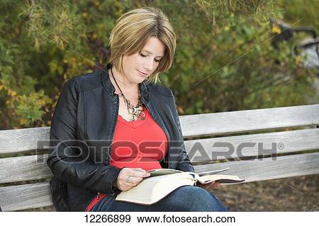 Mature Christian woman studying her Bible in a park; Edmonton, Alberta, Canada View Large Photo Image Stock Photo - Mature Christian woman studying her Bible in a park; Edmonton, Alberta, Canada. Fotosearch