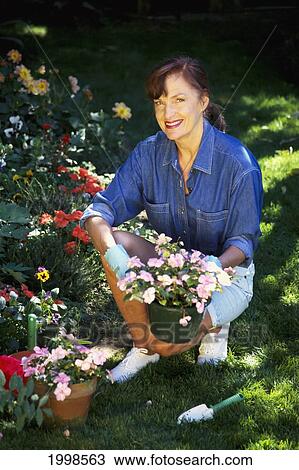 Mature Woman In Garden, Potted Plants, Smiling View Large Photo Image Stock Image - Mature Woman In Garden, Potted Plants, Smiling. Fotosearch
