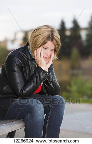 Mature woman on park bench overcome with despair; Edmonton, Alberta, Canada View Large Photo Image Picture - Mature woman on park bench overcome with despair; Edmonton, Alberta, Canada. Fotosearch