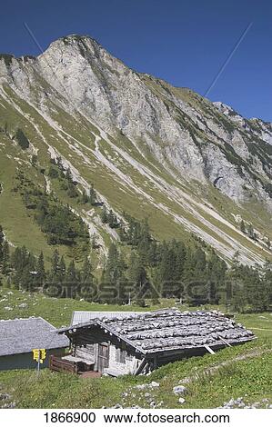 Stock Image - Maurach, Austria; Wooden Alpine Hut In The Mountains. Fotosearch