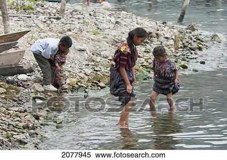 Maya Children Play On The Shores Of Lake Atitlan, Santa Catarina Palopo, Solol View Large Photo Image Stock Photography - Maya Children Play On The Shores Of Lake Atitlan, Santa Catarina Palopo, Solol. Fotosearch