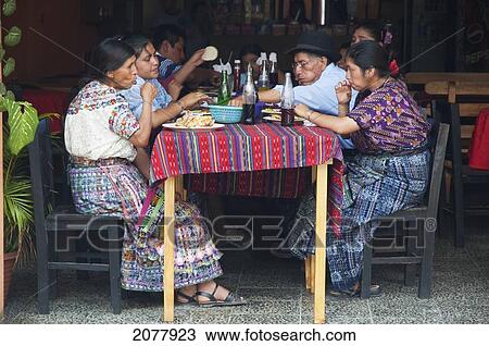 Stock Image - Maya Family Enjoying Lunch At A Restaurant, Santiago De Atitl. Fotosearch