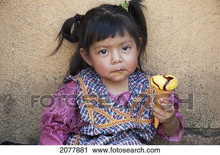 Stock Image - Maya Girl Enjoying An Ice Cream, Antigua, Sacatep. Fotosearch