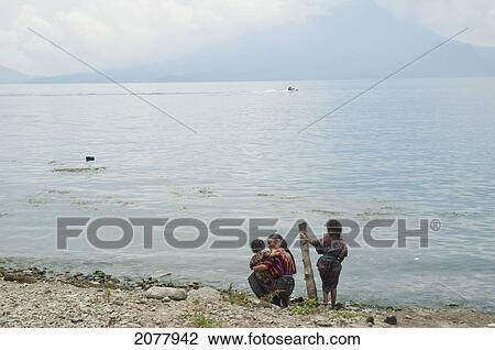 Stock Image - Maya Girls On The Shores Of Lake Atitlan, Santa Catarina Palopo, Solol. Fotosearch