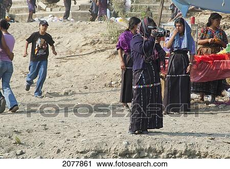 Stock Image - Maya People By The Shores Of Lake Atitlan On Easter Sunday, Panajachel, Solol. Fotosearch
