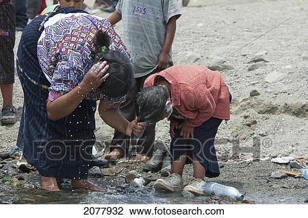 Stock Image - Maya People By The Shores Of Lake Atitlan On Easter Sunday, Panajachel, Solol. Fotosearch