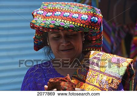 Maya Woman Selling Embroidered Table Cloths At The Sunday Market In Chichicastenango, El Quich View Large Photo Image Stock Photo - Maya Woman Selling Embroidered Table Cloths At The Sunday Market In Chichicastenango, El Quich. Fotosearch