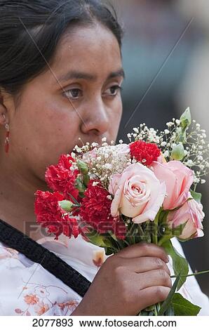 Stock Image - Maya Woman With A Bouquet Of Roses & Carnations, Antigua, Sacatep. Fotosearch