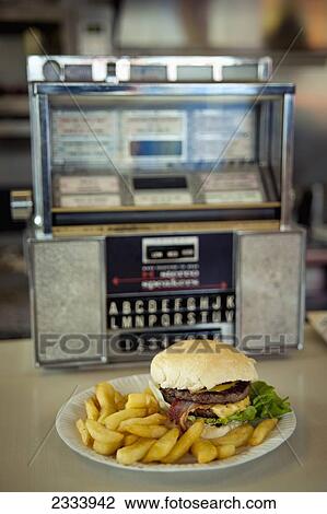 Stock Image - Meal With Jukebox In Docklands; London, Uk. Fotosearch