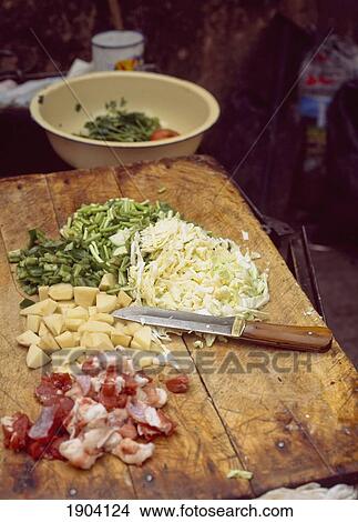 Meat And Vegetables On Chopping Board In Preparation For Cooking, Kashgar, Xinjiang, China. View Large Photo Image Picture - Meat And Vegetables On Chopping Board In Preparation For Cooking, Kashgar, Xinjiang, China.. Fotosearch