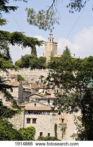 Stock Photograph - Medieval Besalu Village Through Trees. Fotosearch