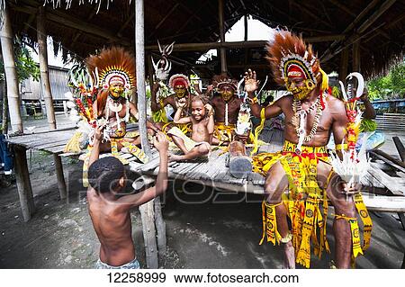 Stock Photo - Mekeo tribesmen from the Central province prepare for traditional ceremony; Papua New Guinea. Fotosearch