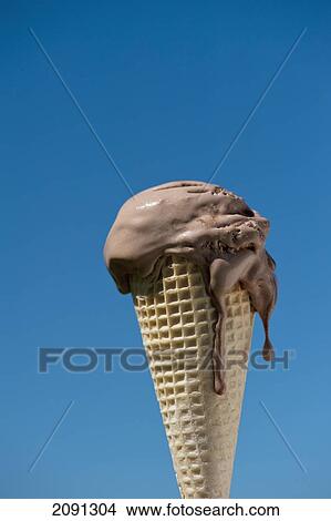 Picture - Melting Ice Cream Against A Blue Sky, West Sussex, Uk. Fotosearch