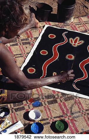 Stock Image - Member Of Walpari Tribe Painting On Cloth, Close-Up. Fotosearch
