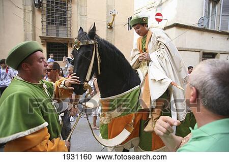 Members of neighbourhood districts, dressed in medieval clothing, perform on horseback near Siena Cathedral. Siena, Tuscany. Italy., Siena, Tuscany. Italy. View Large Photo Image Stock Image - Members of neighbourhood districts, dressed in medieval clothing, perform on horseback near Siena Cathedral. Siena, Tuscany. Italy., Siena, Tuscany. Italy.. Fotosearch