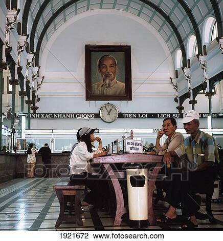 Men And Woman Sitting On A Bench Inside Saigon Post Office 1; Ho Chi Minh. Vietnam View Large Photo Image Stock Image - Men And Woman Sitting On A Bench Inside Saigon Post Office 1; Ho Chi Minh. Vietnam. Fotosearch