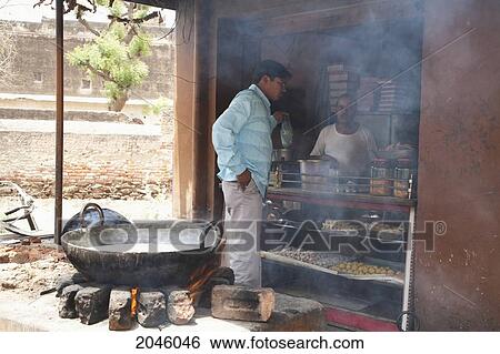 Men At A Traditional Indian Sweets Store, Nawalgarh, Rajasthan, India View Large Photo Image Stock Photograph - Men At A Traditional Indian Sweets Store, Nawalgarh, Rajasthan, India. Fotosearch