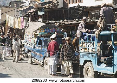 Stock Image - Men At The Bazaar, Becham, North-West Frontier Province, Pakistan. Fotosearch