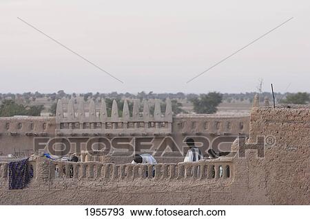 Stock Image - Men At Traditional Sudanese Architecture In Djenne, Mali. Fotosearch
