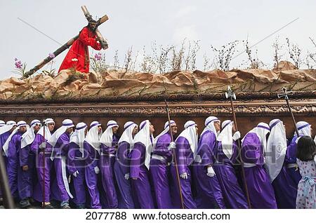 Stock Photo - Men Carrying The Anda (Float) Of Jesus Carrying The Cross During The Procession Of The Holy Cross On Good Friday In Antigua Guatemala, Sacatep. Fotosearch